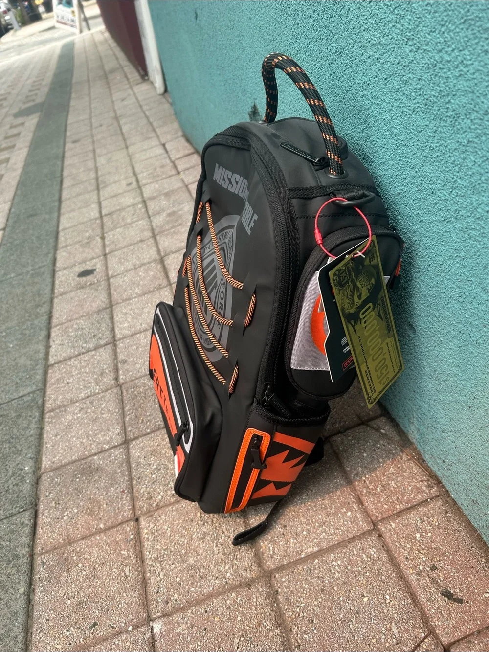 Sprayground Black and Orange 'Mission: Impossible' Certified Backpack